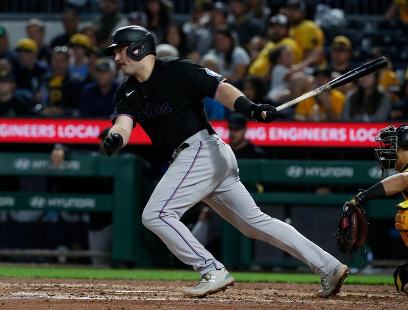 Sep 29, 2023; Pittsburgh, Pennsylvania, USA;  Miami Marlins third baseman Jake Burger (36) hits an RBI single against the Pittsburgh Pirates during the eighth inning at PNC Park. Mandatory Credit: Charles LeClaire-USA TODAY Sports