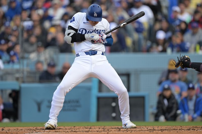 Apr 14, 2024; Los Angeles, California, USA; Los Angeles Dodgers designated hitter Shohei Ohtani (17) backs off an inside pitch in the third inning against the San Diego Padres at Dodger Stadium. Mandatory Credit: Jayne Kamin-Oncea-USA TODAY Sports