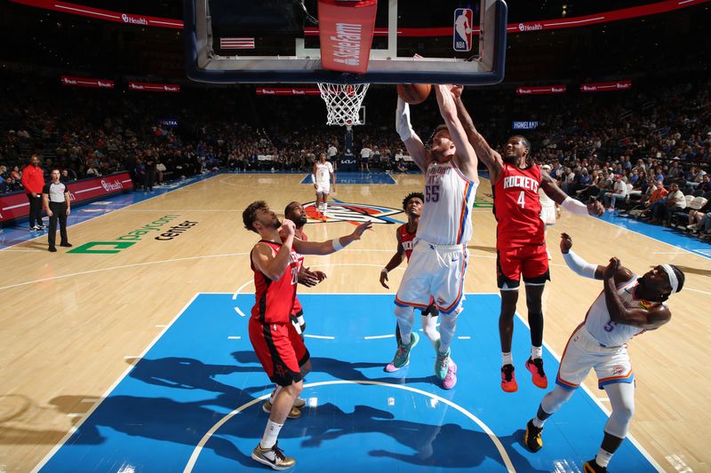 OKLAHOMA CITY, OK - OCTOBER 9: Isaiah Hartenstein #55 of the Oklahoma City Thunder goes up for the rebound during the game against the Houston Rockets during a NBA pre season game on October 9, 2024 at Paycom Center in Oklahoma City, Oklahoma. NOTE TO USER: User expressly acknowledges and agrees that, by downloading and or using this photograph, User is consenting to the terms and conditions of the Getty Images License Agreement. Mandatory Copyright Notice: Copyright 2024 NBAE (Photo by Zach Beeker/NBAE via Getty Images)