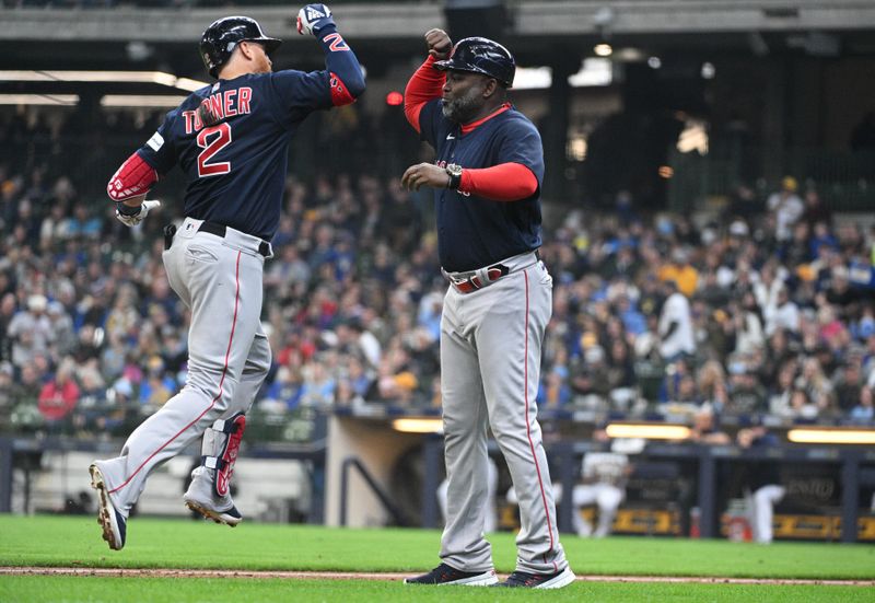 Apr 23, 2023; Milwaukee, Wisconsin, USA; Boston Red Sox first baseman Justin Turner (2) celebrates with Boston Red Sox third base coach Carlos Febles (53) after hitting a home run against the Milwaukee Brewers at American Family Field. Mandatory Credit: Michael McLoone-USA TODAY Sports