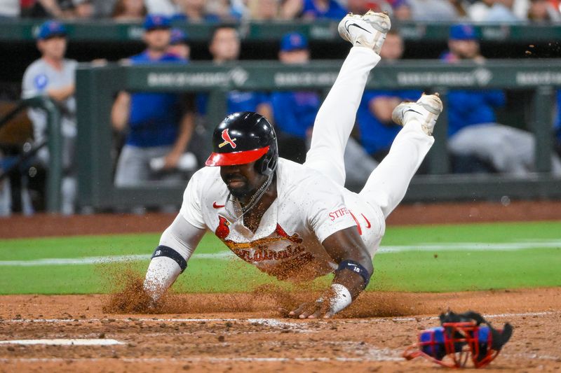 Aug 10, 2025; St. Louis, Missouri, USA;  St. Louis Cardinals right fielder Jordan Walker (18) slides head first to score against the Chicago Cubs during the seventh inning at Busch Stadium. Mandatory Credit: Jeff Curry-Imagn Images