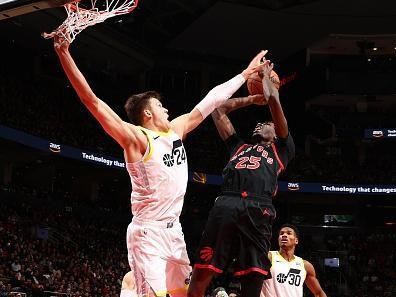 TORONTO, CANADA - DECEMBER 23:  Chris Boucher #25 of the Toronto Raptors drives to the basket during the game as Walker Kessler #24 of the Utah Jazz plays defense on December 23, 2023 at the Scotiabank Arena in Toronto, Ontario, Canada.  NOTE TO USER: User expressly acknowledges and agrees that, by downloading and or using this Photograph, user is consenting to the terms and conditions of the Getty Images License Agreement.  Mandatory Copyright Notice: Copyright 2023 NBAE (Photo by Vaughn Ridley/NBAE via Getty Images)