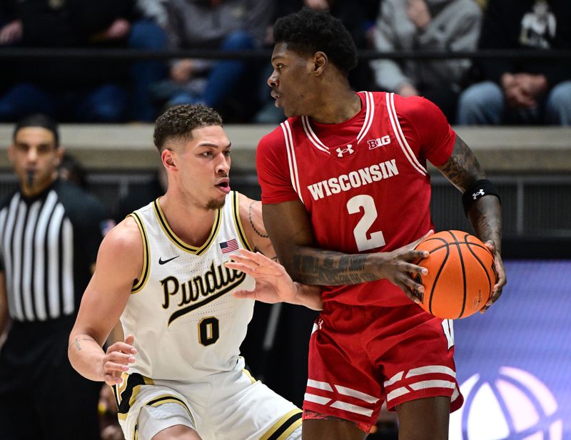 Mar 10, 2024; West Lafayette, Indiana, USA; Wisconsin Badgers guard AJ Storr (2) looks to get around Purdue Boilermakers forward Mason Gillis (0) during the second half at Mackey Arena. Mandatory Credit: Marc Lebryk-USA TODAY Sports