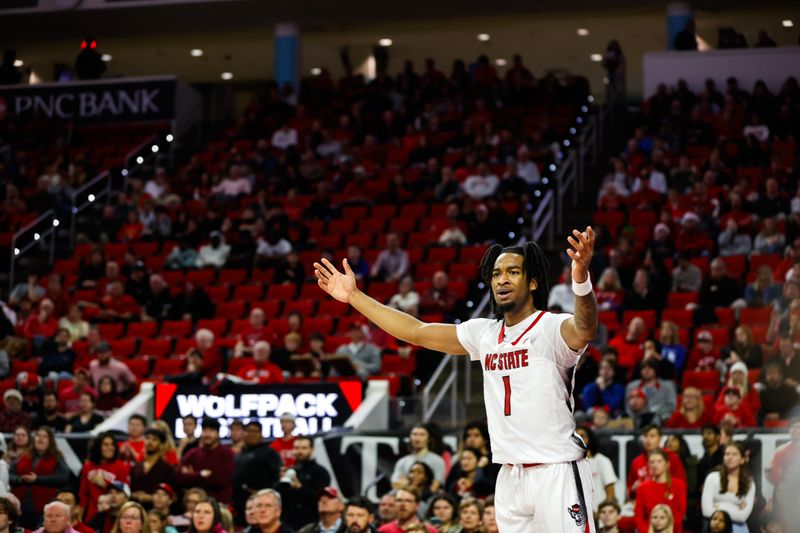 Dec 20, 2023; Raleigh, North Carolina, USA; North Carolina State Wolfpack guard Jayden Taylor (1) reacts during the first half against Saint Louis at PNC Arena. Mandatory Credit: Jaylynn Nash-USA TODAY Sports