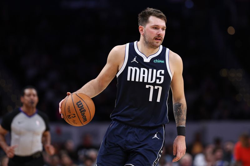 WASHINGTON, DC - NOVEMBER 15: Luka Doncic #77 of the Dallas Mavericks dribbles the ball against the Washington Wizards during the first half at Capital One Arena on November 15, 2023 in Washington, DC. NOTE TO USER: User expressly acknowledges and agrees that, by downloading and or using this photograph, User is consenting to the terms and conditions of the Getty Images License Agreement. (Photo by Patrick Smith/Getty Images)