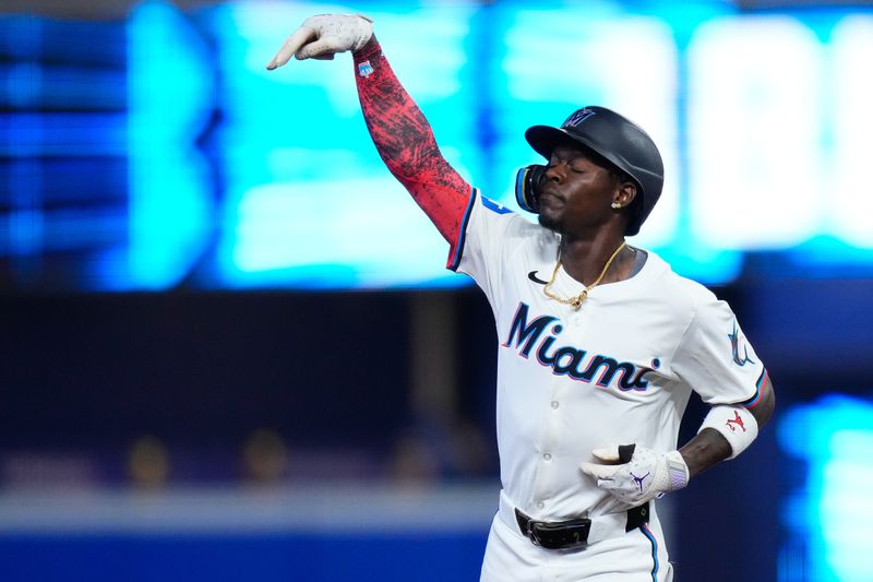 May 22, 2024; Miami, Florida, USA; Miami Marlins outfielder Jazz Chisholm Jr. (2) rounds the bases after hitting a home run against the Milwaukee Brewers during the first inning at loanDepot Park. Mandatory Credit: Rich Storry-USA TODAY Sports