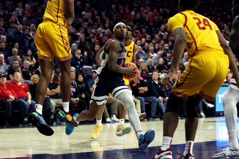 Jan 17, 2024; Tucson, Arizona, USA; Arizona Wildcats guard Caleb Love (2) drives to the net against USC Trojans forward Joshua Morgan (24) during the second half at McKale Center. Mandatory Credit: Zachary BonDurant-USA TODAY Sports