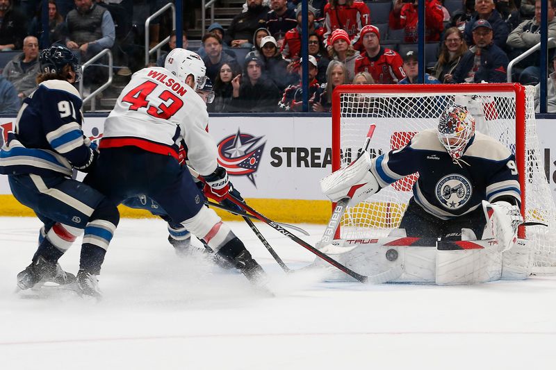 uDec 21, 2023; Columbus, Ohio, USA; Columbus Blue Jackets goalie Elvis Merzlikins (90) makes a save on the shot from Washington Capitals right wing Tom Wilson (43) during overtime at Nationwide Arena. Mandatory Credit: Russell LaBounty-USA TODAY Sports