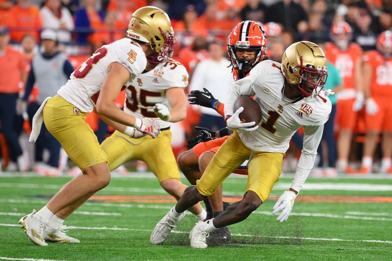 Nov 3, 2023; Syracuse, New York, USA; Boston College Eagles defensive back Elijah Jones (1) returns an interception against the Syracuse Orange during the second half at the JMA Wireless Dome. Mandatory Credit: Rich Barnes-USA TODAY Sports