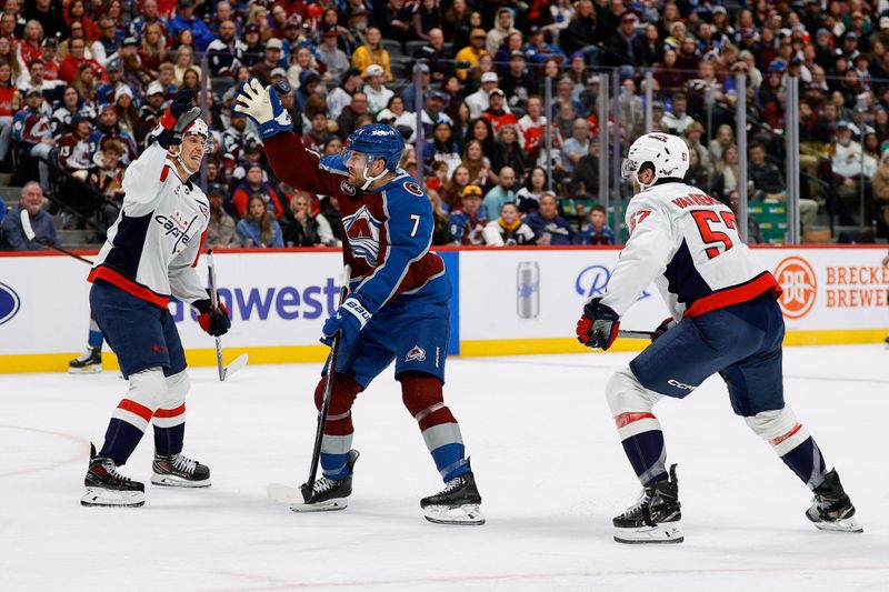 Nov 15, 2024; Denver, Colorado, USA; Colorado Avalanche defenseman Devon Toews (7) and Washington Capitals center Dylan Strome (17) reach for a loose puck as defenseman Trevor van Riemsdyk (57) looks on in the second period at Ball Arena. Mandatory Credit: Isaiah J. Downing-Imagn Images