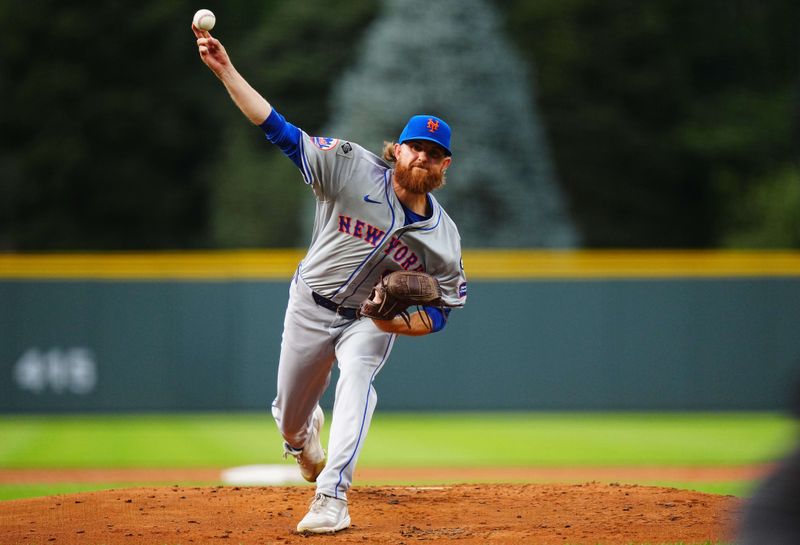 Aug 7, 2024; Denver, Colorado, USA; New York Mets starting pitcher Paul Blackburn (58) delivers a pitch in the first inning against the Colorado Rockies at Coors Field. Mandatory Credit: Ron Chenoy-USA TODAY Sports