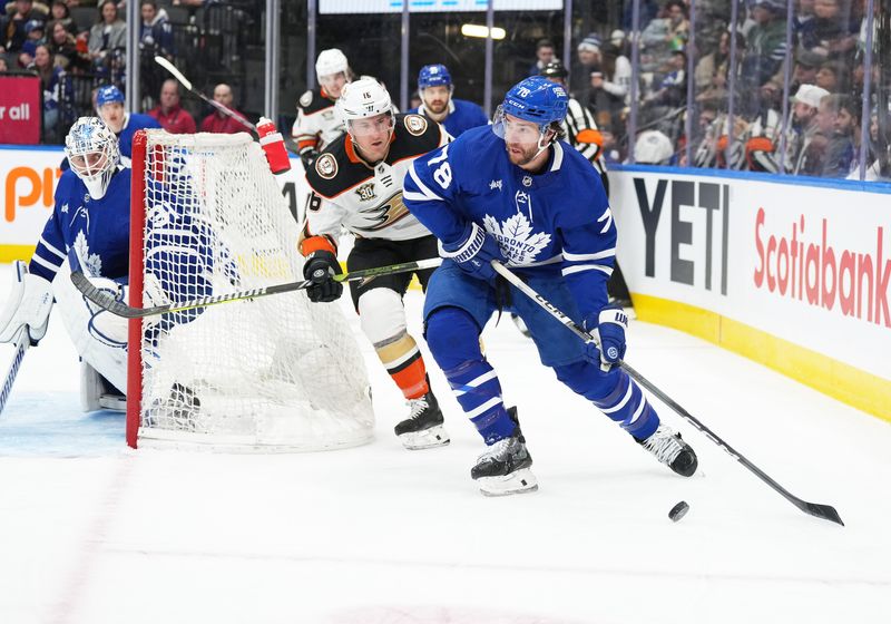 Feb 17, 2024; Toronto, Ontario, CAN; Toronto Maple Leafs defenseman TJ Brodie (78) controls the puck as Anaheim Ducks center Ryan Strome (16) tries to defend during the second period at Scotiabank Arena. Mandatory Credit: Nick Turchiaro-USA TODAY Sports