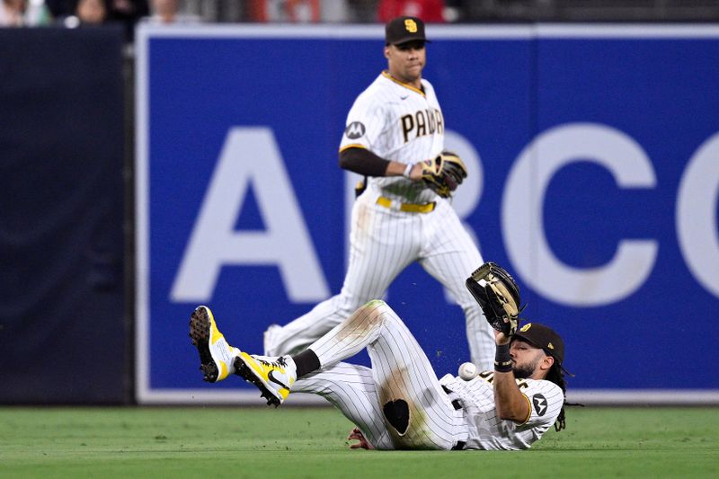 Aug 15, 2023; San Diego, California, USA; San Diego Padres center fielder Fernando Tatis (23) cannot make a catch on a double hit by Baltimore Orioles left fielder Austin Hays (not pictured) during the sixth inning at Petco Park. Mandatory Credit: Orlando Ramirez-USA TODAY Sports