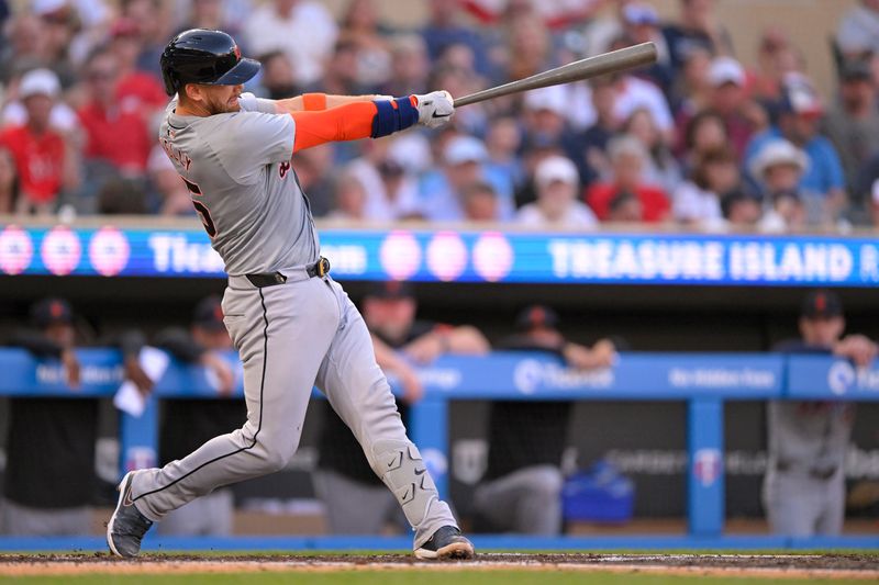 Jul 3, 2024; Minneapolis, Minnesota, USA; Detroit Tigers catcher Carson Kelly (15) hits a grand slam against the Minnesota Twins during the third inning at Target Field. Mandatory Credit: Nick Wosika-USA TODAY Sports