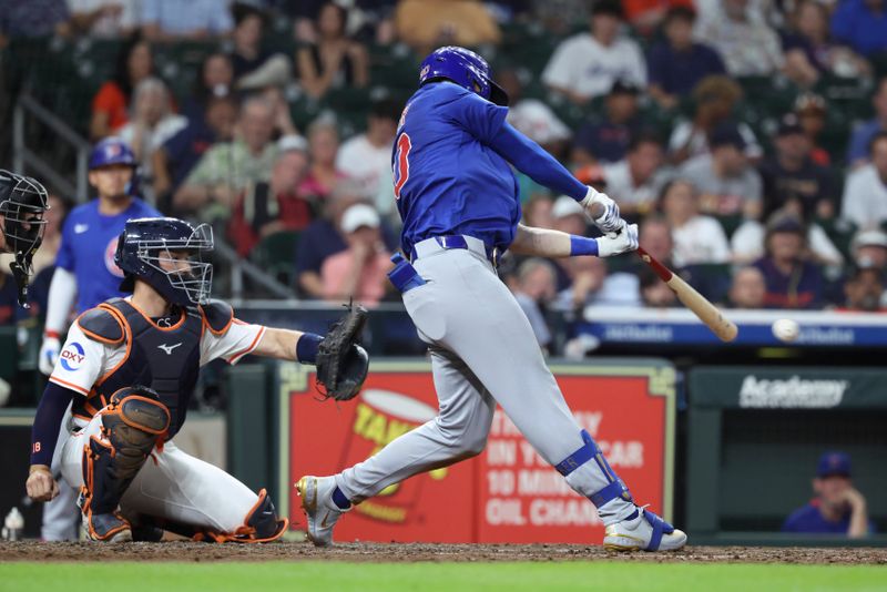 Jun 28, 2025; Houston, Texas, USA; Chicago Cubs right fielder Kyle Tucker (30) hits a single during the eighth inning against the Houston Astros at Daikin Park. Mandatory Credit: Troy Taormina-Imagn Images