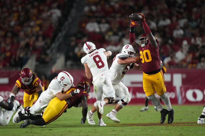 Sep 9, 2023; Los Angeles, California, USA; Southern California Trojans defensive lineman Bear Alexander (90) deflects a pass by Stanford Cardinal quarterback Justin Lamson (8) in the first half at United Airlines Field at Los Angeles Memorial Coliseum. Mandatory Credit: Kirby Lee-USA TODAY Sports