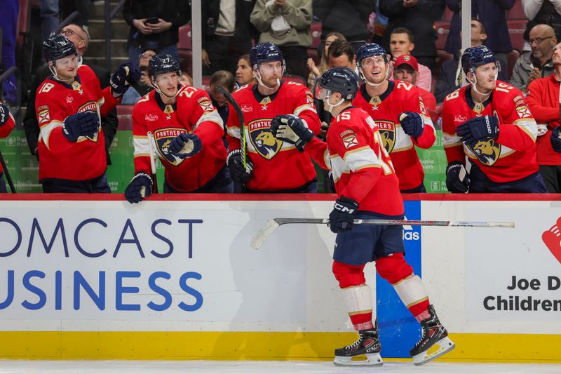 Nov 22, 2023; Sunrise, Florida, USA; Florida Panthers center Anton Lundell (15) celebrates with teammates after scoring against the Boston Bruins during the second period at Amerant Bank Arena. Mandatory Credit: Sam Navarro-USA TODAY Sports