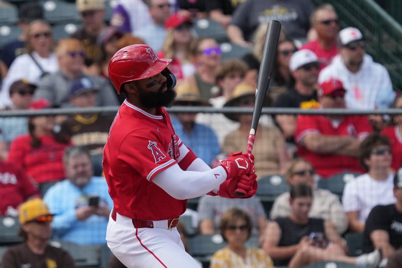 Mar 10, 2026; Tempe, Arizona, USA; Los Angeles Angels center fielder Jo Adell (7) hits a RBI single against the San Diego Padres in the third inning at Tempe Diablo Stadium. Mandatory Credit: Rick Scuteri-Imagn Images