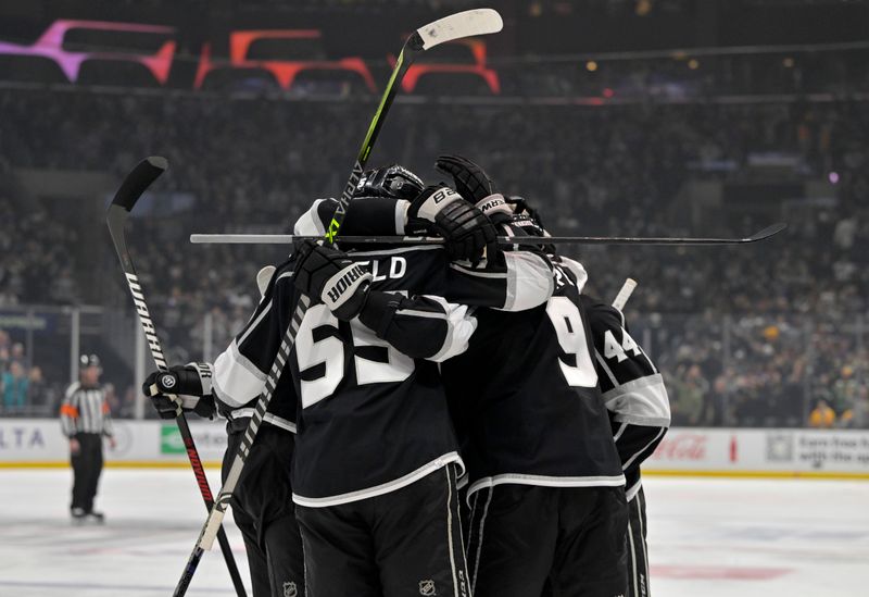 Feb 11, 2023; Los Angeles, California, USA;  Los Angeles Kings right wing Adrian Kempe (9) is congratulated after his second goal of the game against the Pittsburgh Penguins at Crypto.com Arena. Mandatory Credit: Jayne Kamin-Oncea-USA TODAY Sports