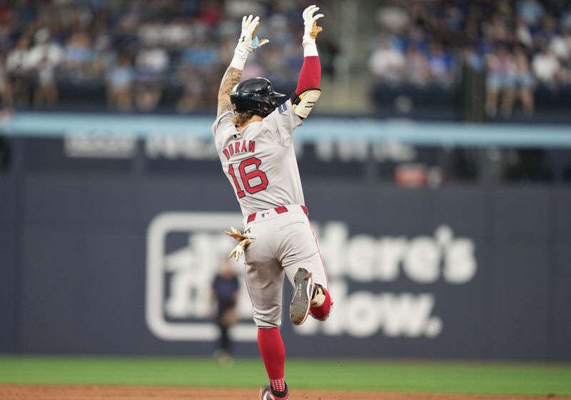 Jun 19, 2024; Toronto, Ontario, CAN; Boston Red Sox right fielder Jarren Duran (16) runs the bases after hitting a home run against the Toronto Blue Jays during fifth inning at Rogers Centre. Mandatory Credit: Nick Turchiaro-USA TODAY Sports