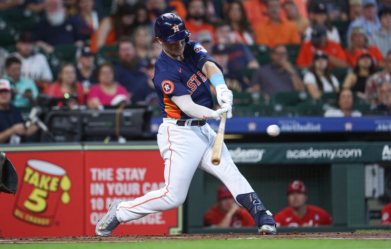 Jun 18, 2023; Houston, Texas, USA; Houston Astros third baseman Alex Bregman (2) hits a double during the first inning against the Cincinnati Reds at Minute Maid Park. Mandatory Credit: Troy Taormina-USA TODAY Sports