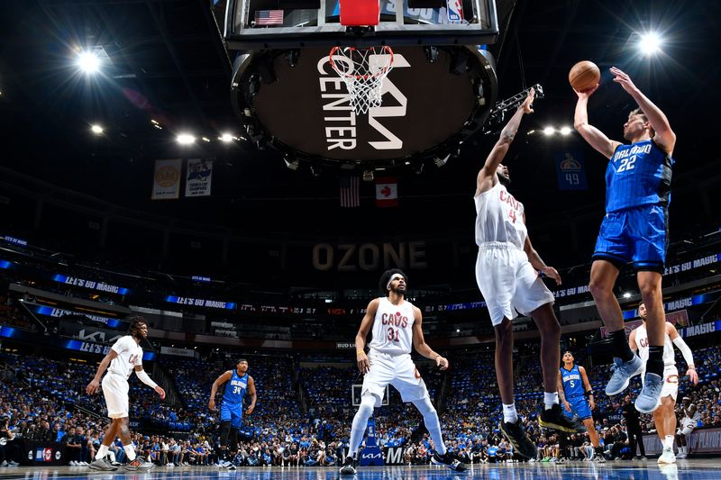 ORLANDO, FL - APRIL 27: Franz Wagner #22 of the Orlando Magic shoots the ball during the game against the Cleveland Cavaliers during Round 1 Game 4 of the 2024 NBA Playoffs on April 27, 2024 at the Kia Center in Orlando, Florida. NOTE TO USER: User expressly acknowledges and agrees that, by downloading and or using this photograph, User is consenting to the terms and conditions of the Getty Images License Agreement. Mandatory Copyright Notice: Copyright 2024 NBAE (Photo by Fernando Medina/NBAE via Getty Images)