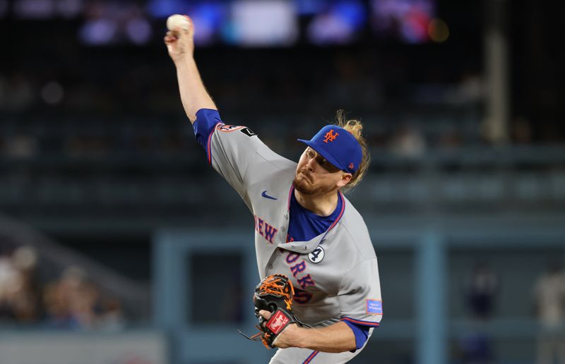Jun 2, 2025; Los Angeles, California, USA; New York Mets pitcher Ryne Stanek (55) throws during the eighth inning against the Los Angeles Dodgers at Dodger Stadium. Mandatory Credit: Jason Parkhurst-Imagn Images