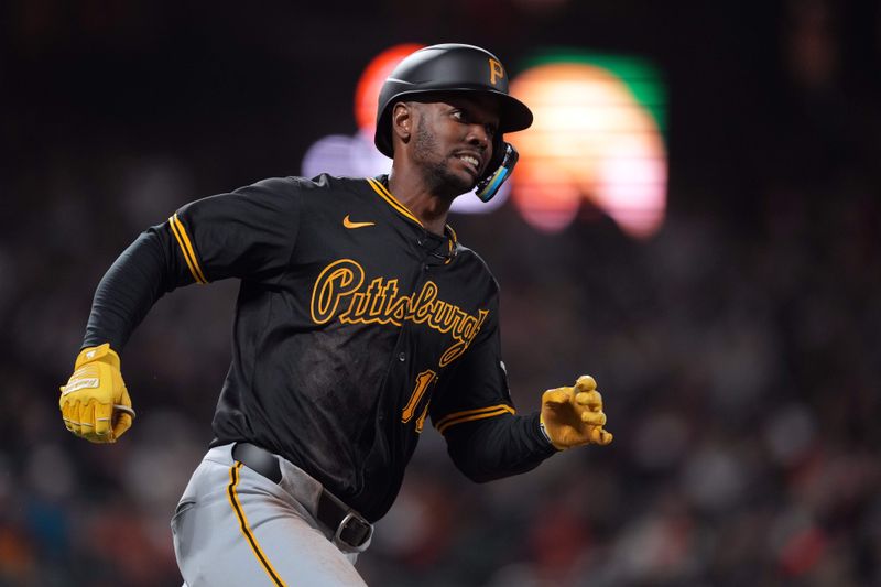 Apr 26, 2024; San Francisco, California, USA; Pittsburgh Pirates center fielder Michael A. Taylor (18) runs to first base after hitting a single against the San Francisco Giants during the ninth inning at Oracle Park. Mandatory Credit: Darren Yamashita-USA TODAY Sports