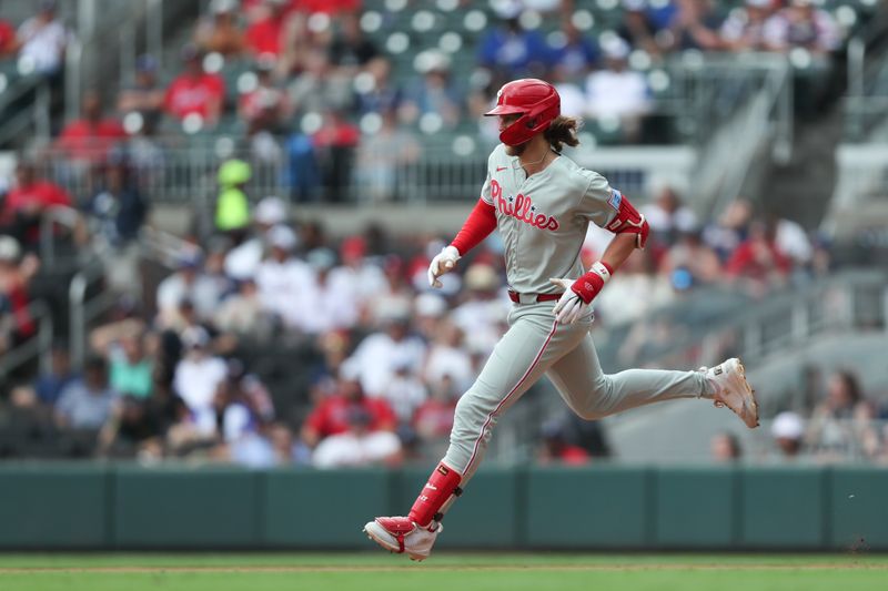 Jun 29, 2025; Cumberland, Georgia, Philadelphia Phillies third baseman Alec Bohm (28) runs to second base during a game against the Atlanta Braves during the eighth inning at Truist Park. Mandatory Credit: Mady Mertens-Imagn Images