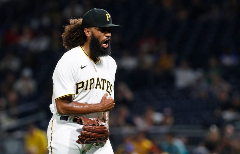 Aug 8, 2023; Pittsburgh, Pennsylvania, USA;  Pittsburgh Pirates relief pitcher Andre Jackson (41) reacts after recording a strike out to end the eighth inning against the Atlanta Braves at PNC Park. Mandatory Credit: Charles LeClaire-USA TODAY Sports