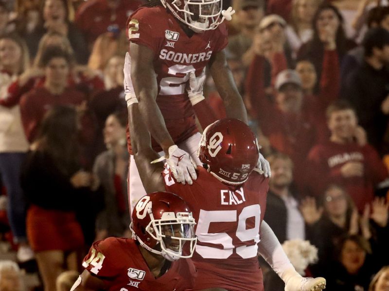 Nov 9, 2019; Norman, OK, USA; Oklahoma Sooners wide receiver CeeDee Lamb (2) celebrates with offensive lineman Adrian Ealy (59) after scoring a touchdown during the second quarter against the Iowa State Cyclones at Gaylord Family - Oklahoma Memorial Stadium. Mandatory Credit: Kevin Jairaj-USA TODAY Sports