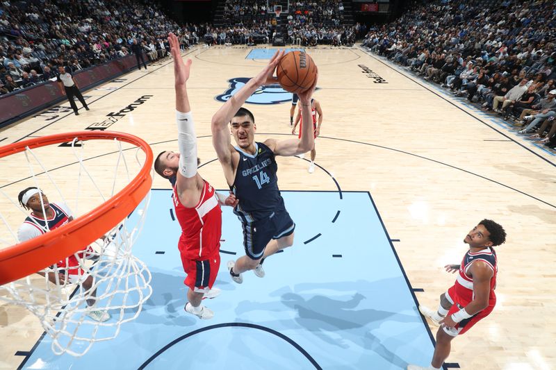 MEMPHIS, TN - NOVEMBER 8: Zach Edey #14 of the Memphis Grizzlies drives to the basket during the game against the Washington Wizards on November 8, 2024 at FedExForum in Memphis, Tennessee. NOTE TO USER: User expressly acknowledges and agrees that, by downloading and or using this photograph, User is consenting to the terms and conditions of the Getty Images License Agreement. Mandatory Copyright Notice: Copyright 2024 NBAE (Photo by Joe Murphy/NBAE via Getty Images)