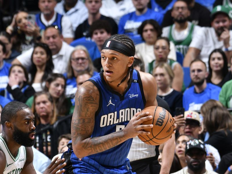 ORLANDO, FL - APRIL 27:  Paolo Banchero #5 of the Orlando Magic against the Boston Celtics   during Round 1 Game 4 of the 2025 NBA Playoffs on April 27, 2025 at Kia Center in Orlando, Florida. NOTE TO USER: User expressly acknowledges and agrees that, by downloading and or using this photograph, User is consenting to the terms and conditions of the Getty Images License Agreement. Mandatory Copyright Notice: Copyright 2025 NBAE (Photo by Fernando Medina/NBAE via Getty Images)