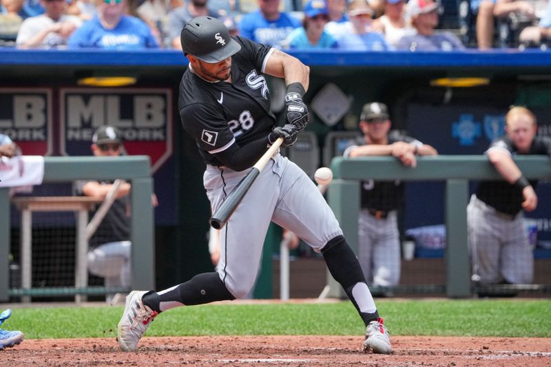 Jul 21, 2024; Kansas City, Missouri, USA; Chicago White Sox left fielder Tommy Pham (28) hits an RBI single against the Kansas City Royals in the fifth inning at Kauffman Stadium. Mandatory Credit: Denny Medley-USA TODAY Sports