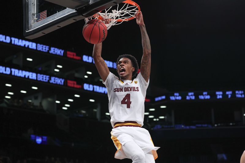 Nov 17, 2022; Brooklyn, New York, USA; Arizona State Sun Devils guard Desmond Cambridge Jr. (4) dunks the ball during the second half against the Michigan Wolverines at Barclays Center. Mandatory Credit: Vincent Carchietta-USA TODAY Sports