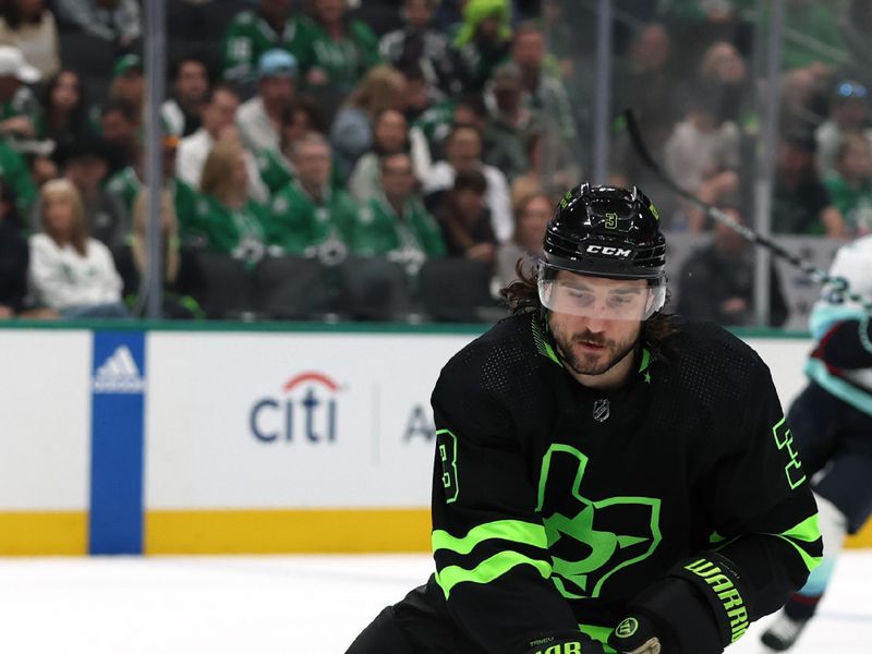 Apr 13, 2024; Dallas, Texas, USA; Dallas Stars defenseman Chris Tanev (3) controls the puck in the first period against the Seattle Kraken at American Airlines Center. Mandatory Credit: Tim Heitman-USA TODAY Sports