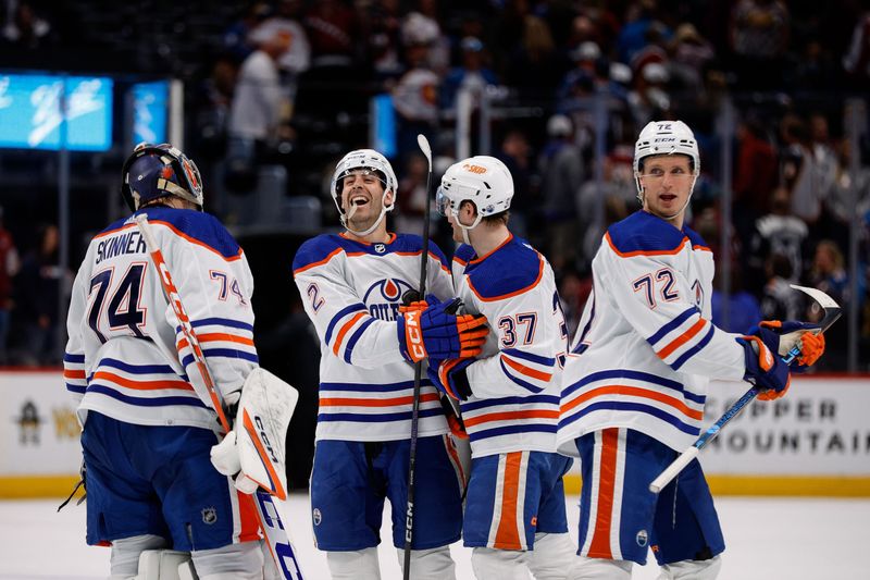 Apr 11, 2023; Denver, Colorado, USA; Edmonton Oilers defenseman Evan Bouchard (2) celebrates with left wing Warren Foegele (37) and goaltender Stuart Skinner (74) and center Nick Bjugstad (72) after the game against the Colorado Avalanche at Ball Arena. Mandatory Credit: Isaiah J. Downing-USA TODAY Sports