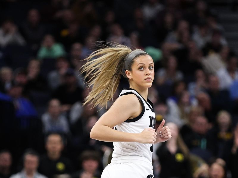 Mar 4, 2023; Minneapolis, MINN, USA; Iowa Hawkeyes guard Gabbie Marshall (24) reacts to her shot against the Maryland Terrapins during the first half at Target Center. Mandatory Credit: Matt Krohn-USA TODAY Sports