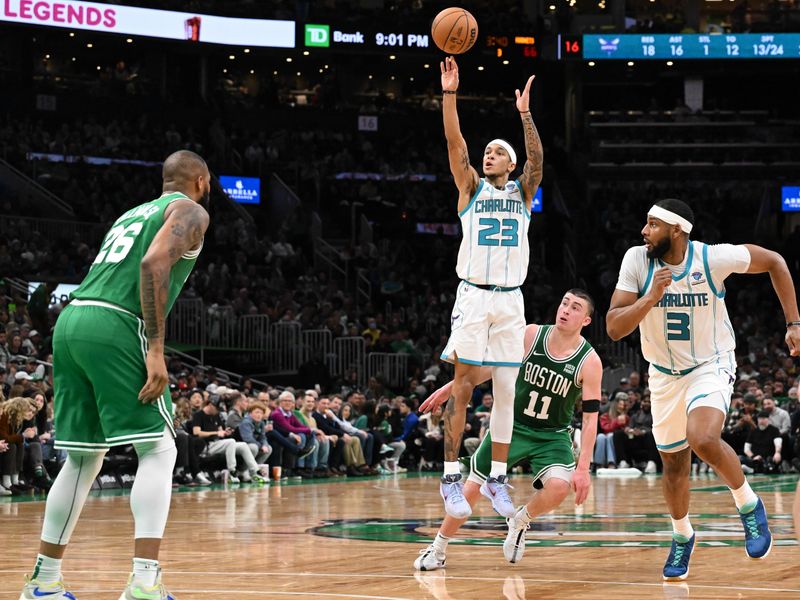 BOSTON, MASSACHUSETTS - APRIL 12: Tre Mann #23 of the Charlotte Hornets attempts a three-point basket against the Boston Celtics during the third quarter at the TD Garden on April 12, 2024 in Boston, Massachusetts. NOTE TO USER: User expressly acknowledges and agrees that, by downloading and or using this photograph, User is consenting to the terms and conditions of the Getty Images License Agreement. (Photo by Brian Fluharty/Getty Images)