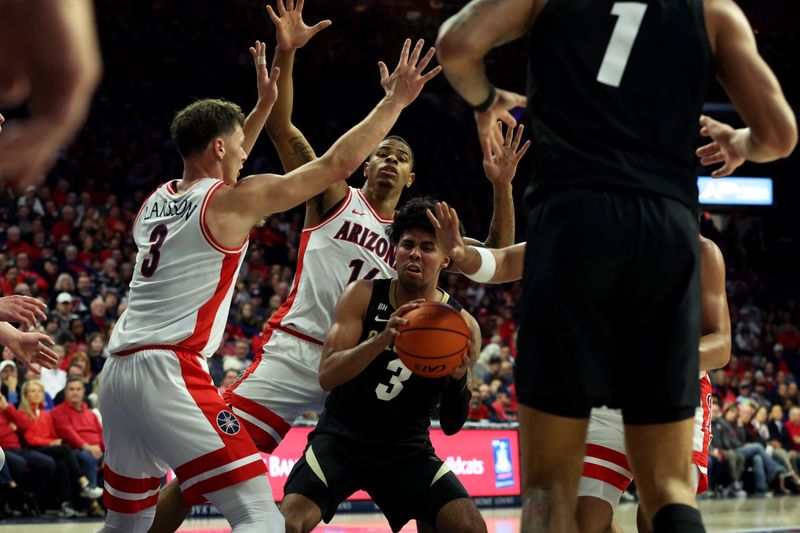 Jan 4, 2024; Tucson, Arizona, USA; Colorado Buffaloes guard Julian Hammond III (3) drives to the net against Arizona Wildcats guard Pelle Larsson (3), and forward Keshad Johnson (16) during the first half at McKale Center. Mandatory Credit: Zachary BonDurant-USA TODAY Sports