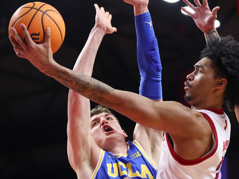 Jan 13, 2025; Piscataway, New Jersey, USA; Rutgers Scarlet Knights guard Dylan Harper (2) drives to the basket against UCLA Bruins forward Tyler Bilodeau (34) during the second half at Jersey Mike's Arena. Mandatory Credit: Vincent Carchietta-Imagn Images