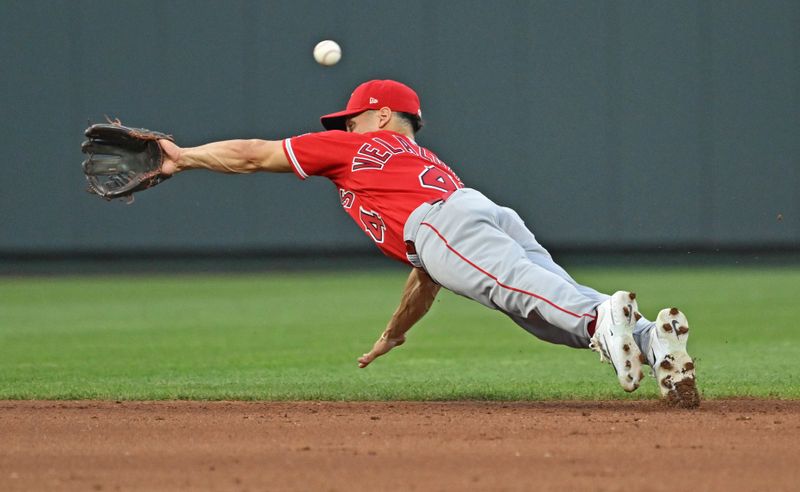 Jun 16, 2023; Kansas City, Missouri, USA; Los Angeles Angels shortstop Andrew Velazquez (4) dives for a ball hit by Kansas City Royals third baseman Matt Duffy (not pictured) in the fourth inning at Kauffman Stadium. Mandatory Credit: Peter Aiken-USA TODAY Sports