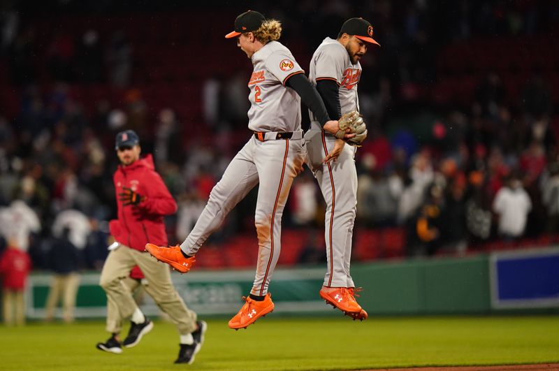 Apr 10, 2024; Boston, Massachusetts, USA; Baltimore Orioles shortstop Gunnar Henderson (2) and teammate react after defeating the Boston Red Sox` in nine innings at Fenway Park. Mandatory Credit: David Butler II-USA TODAY Sports