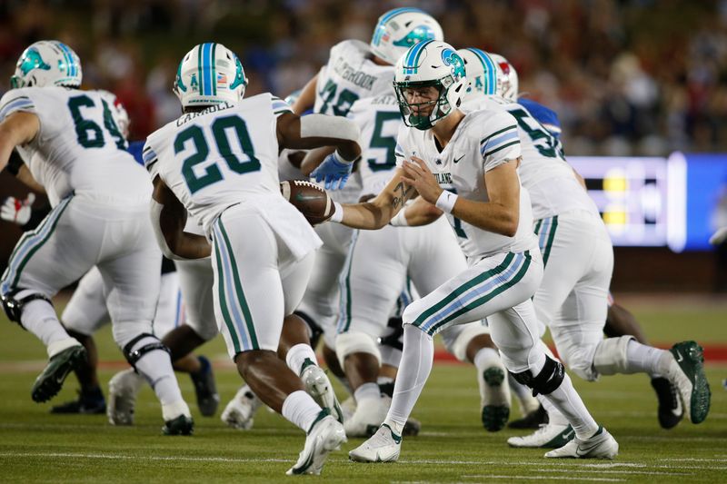 Oct 21, 2021; Dallas, Texas, USA; Tulane Green Wave quarterback Michael Pratt (7) hands off to running back Cameron Carroll (20) in the first quarter at Gerald J. Ford Stadium. Mandatory Credit: Tim Heitman-USA TODAY Sports