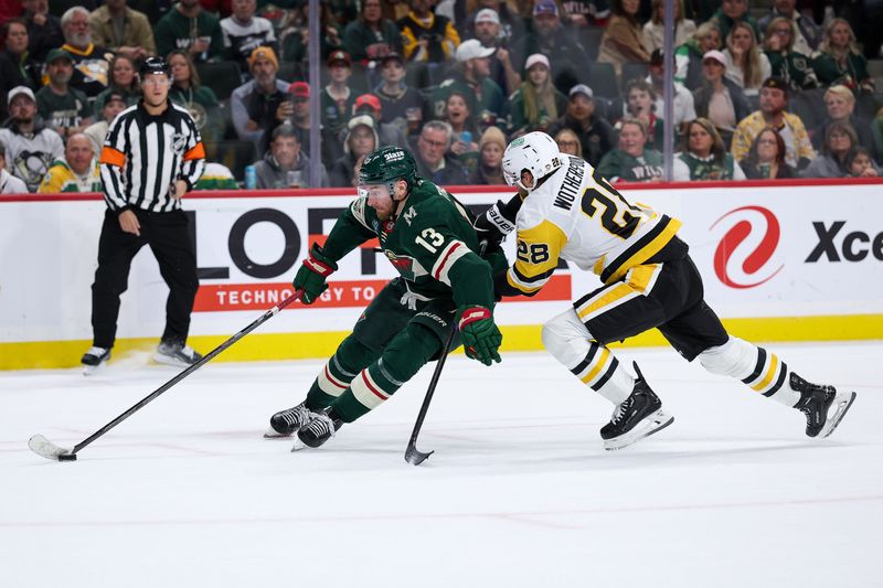 Oct 30, 2025; Saint Paul, Minnesota, USA; Minnesota Wild center Yakov Trenin (13) drives to the net as Pittsburgh Penguins defenseman Parker Wotherspoon (28) defends during the second period at Grand Casino Arena. Mandatory Credit: Matt Krohn-Imagn Images