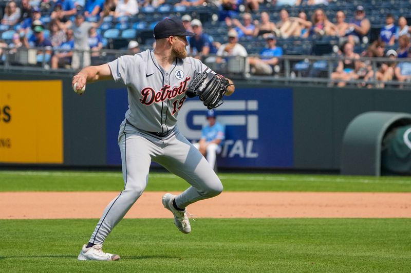 Jun 1, 2025; Kansas City, Missouri, USA; Detroit Tigers relief pitcher Will Vest (19) fields an in field hit and throws to first base for an out against the Kansas City Royals in the ninth inning at Kauffman Stadium. Mandatory Credit: Denny Medley-Imagn Images