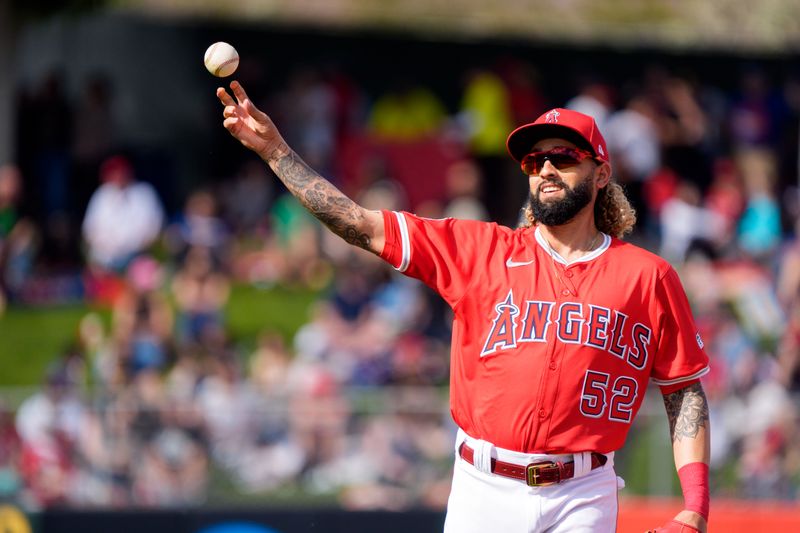 Mar 16, 2024; Tempe, Arizona, USA; Los Angeles Angels infielder Jack Lopez (52) throws to first after fielding the ball in the seventh inning during a spring training game against the Chicago Cubs at Tempe Diablo Stadium. Mandatory Credit: Allan Henry-USA TODAY Sports