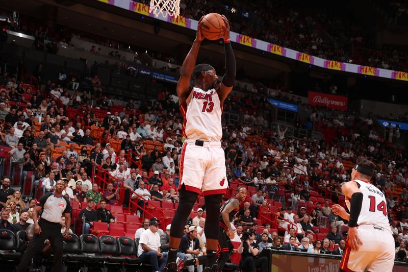 MIAMI, FL - APRIL 19: Bam Adebayo #13 of the Miami Heat grabs the rebound during the game against the Chicago Bulls during the 2024 Play-In Tournament on April 19, 2024 at Kaseya Center in Miami, Florida. NOTE TO USER: User expressly acknowledges and agrees that, by downloading and or using this Photograph, user is consenting to the terms and conditions of the Getty Images License Agreement. Mandatory Copyright Notice: Copyright 2024 NBAE (Photo by Issac Baldizon/NBAE via Getty Images)