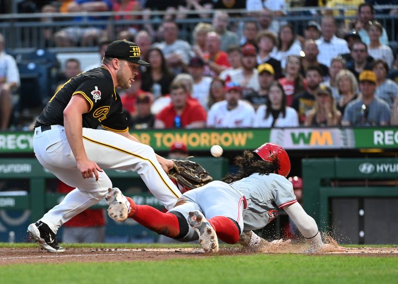 Aug 24, 2024; Pittsburgh, Pennsylvania, USA;  Cincinnati Reds second baseman Jonathan India (6) slides safety into home as Pittsburgh Pirates pitcher Hunter Stratton (63) tries to apply the tag during the fourth inning at PNC Park. Stratton left the game with an apparent injury on the play. Mandatory Credit: Philip G. Pavely-USA TODAY Sports