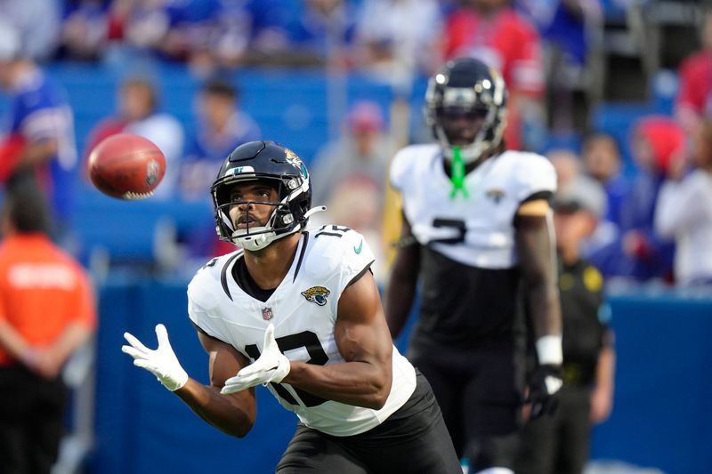 Jacksonville Jaguars wide receiver Devin Duvernay (12) warms up before an NFL football game against the Buffalo Bills, Monday, Sept. 23, 2024, in Orchard Park, NY. (AP Photo/Steven Senne)